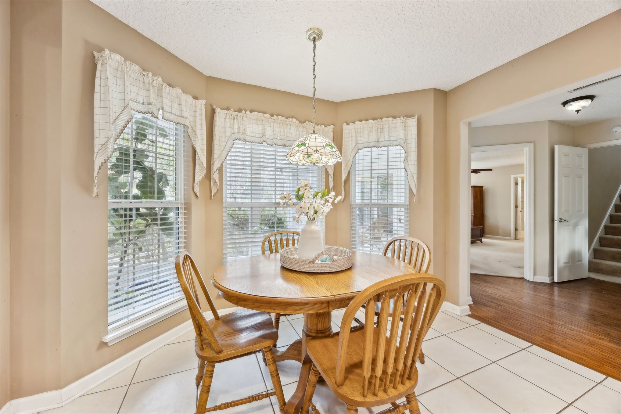 86341 Meadowfield Bluffs Road Yulee, FL 32097 - Photo 19 of 68 a dining room with furniture and wooden floor