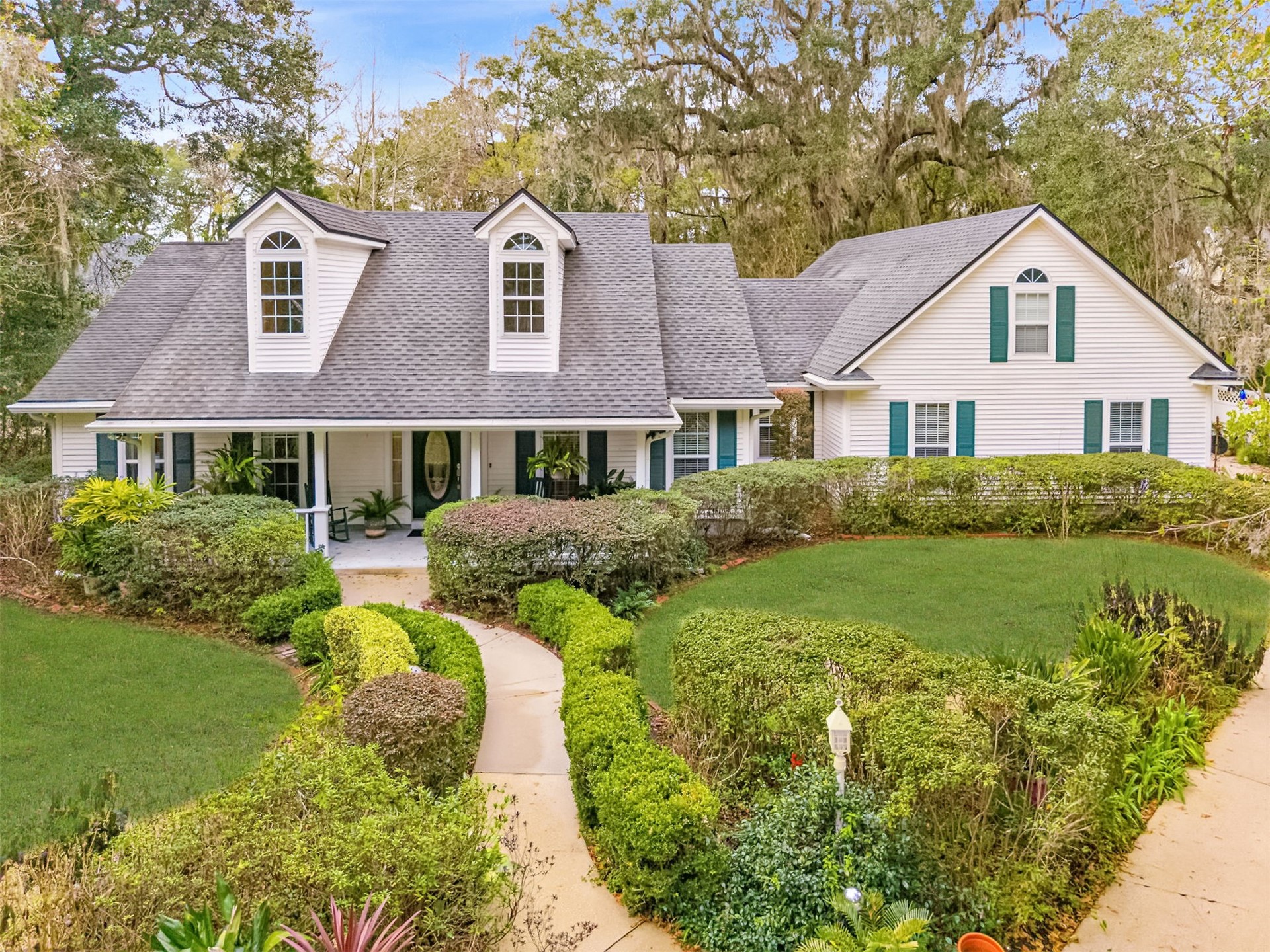 86341 Meadowfield Bluffs Road Yulee, FL 32097 - Photo 2 of 68 a front view of a house with a garden