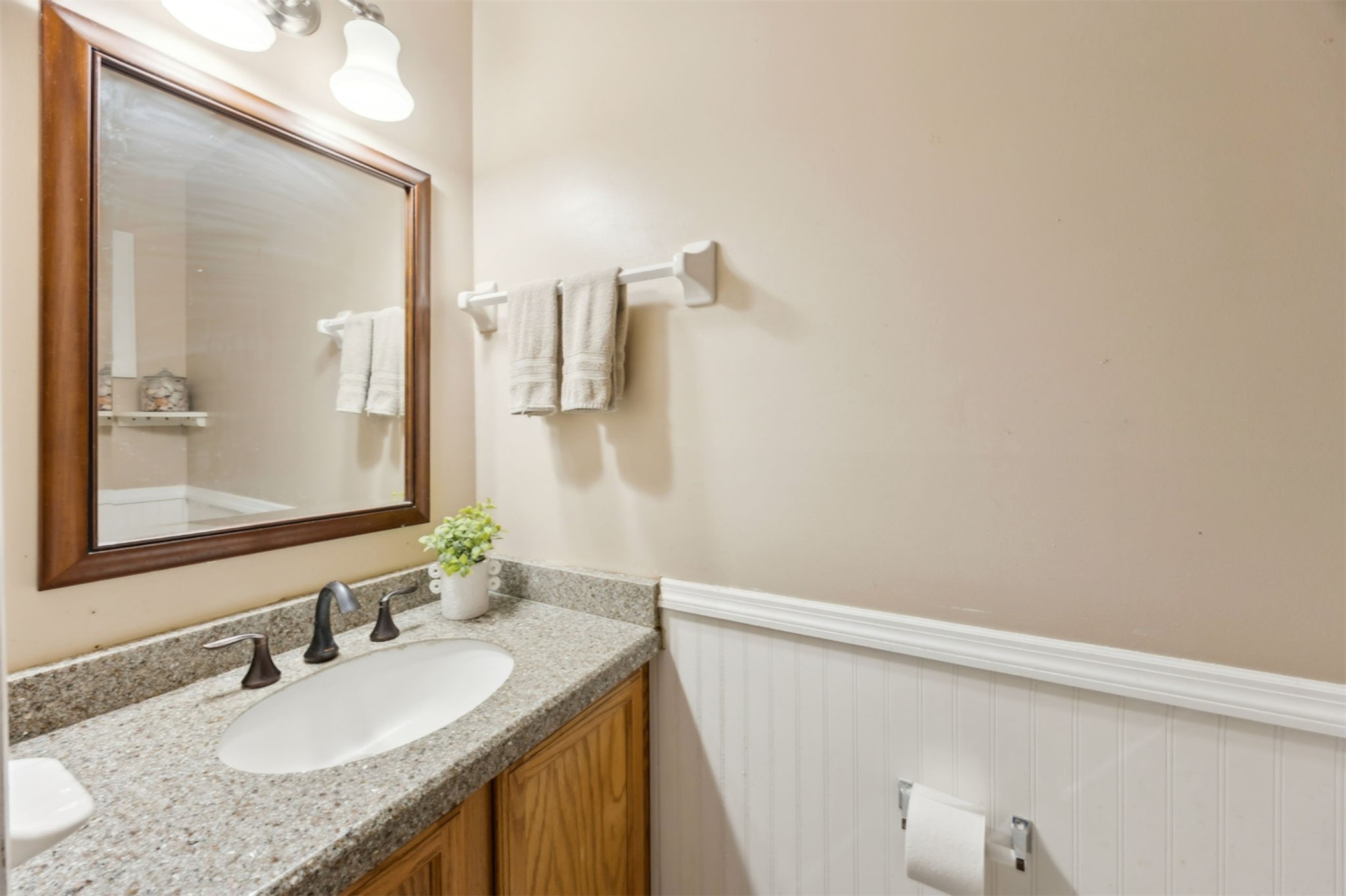 86341 Meadowfield Bluffs Road Yulee, FL 32097 - Photo 20 of 68 a bathroom with a granite countertop sink and a mirror