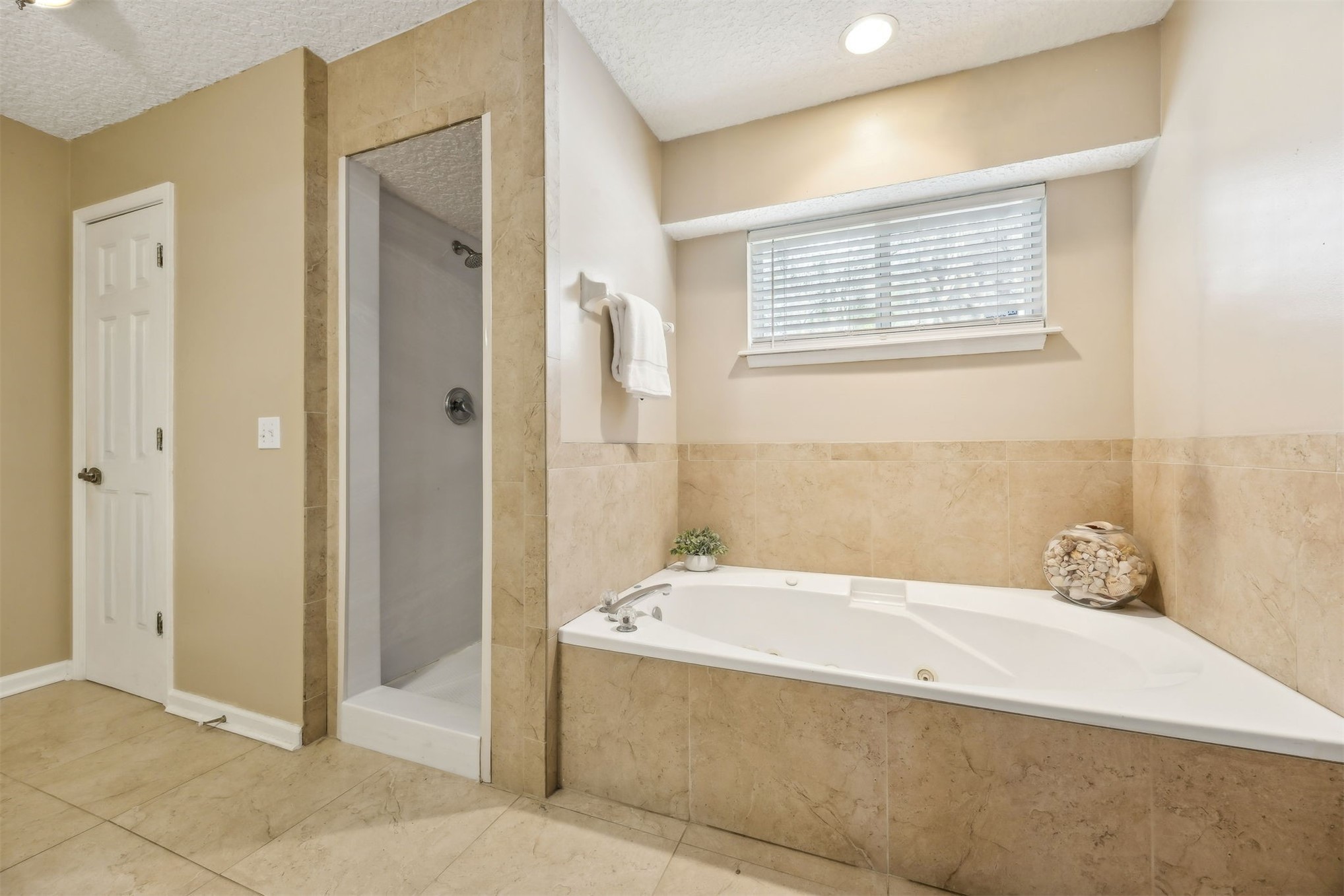 86341 Meadowfield Bluffs Road Yulee, FL 32097 - Photo 24 of 68 a bathroom with a bathtub and a shower
