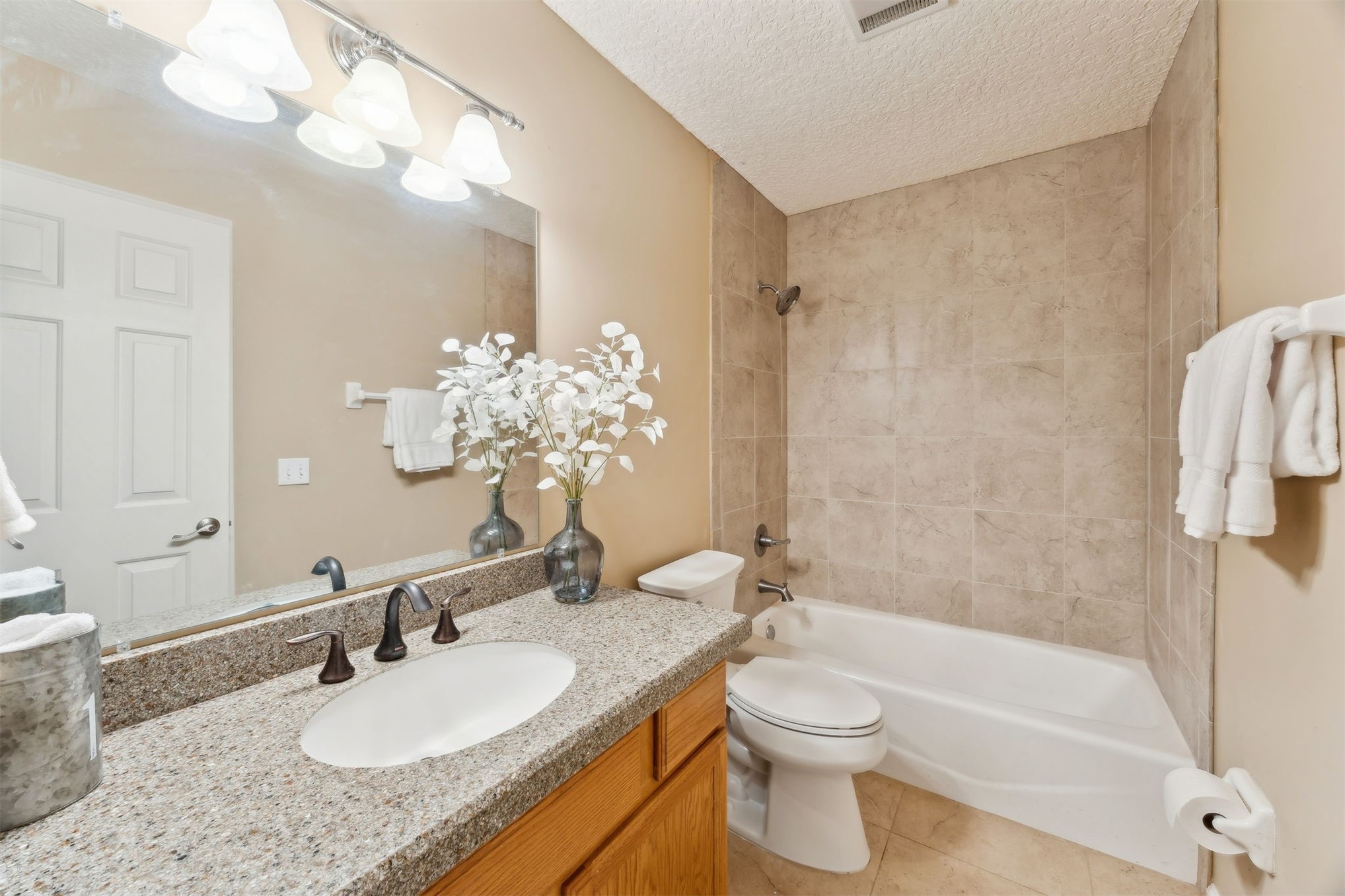 86341 Meadowfield Bluffs Road Yulee, FL 32097 - Photo 26 of 68 a bathroom with a granite countertop sink toilet and shower