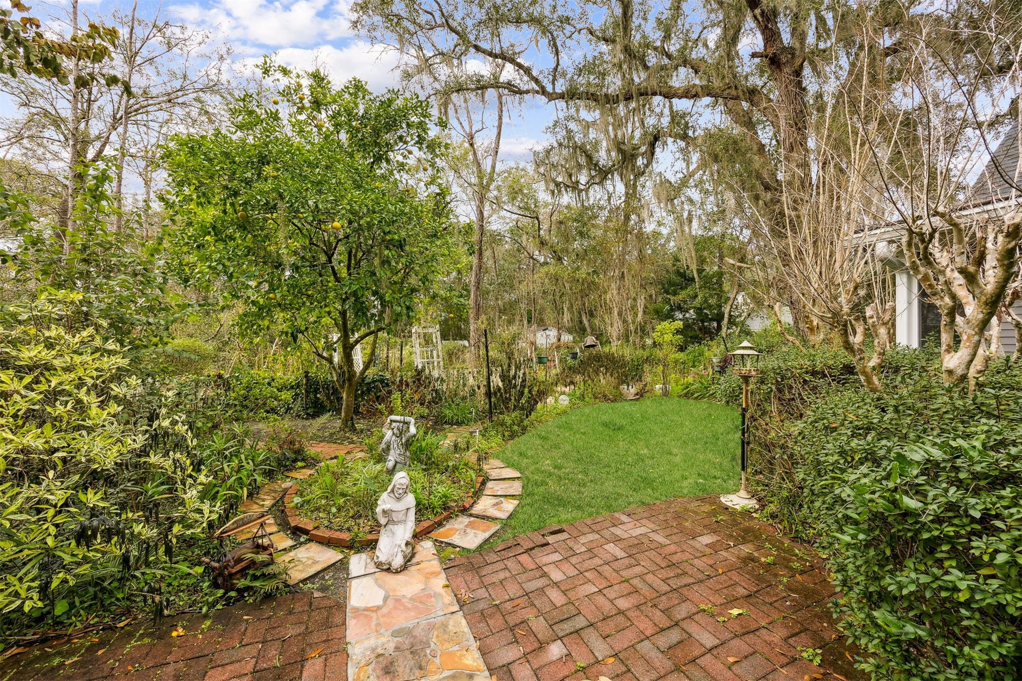 86341 Meadowfield Bluffs Road Yulee, FL 32097 - Photo 34 of 68 a view of a yard with plants and large trees