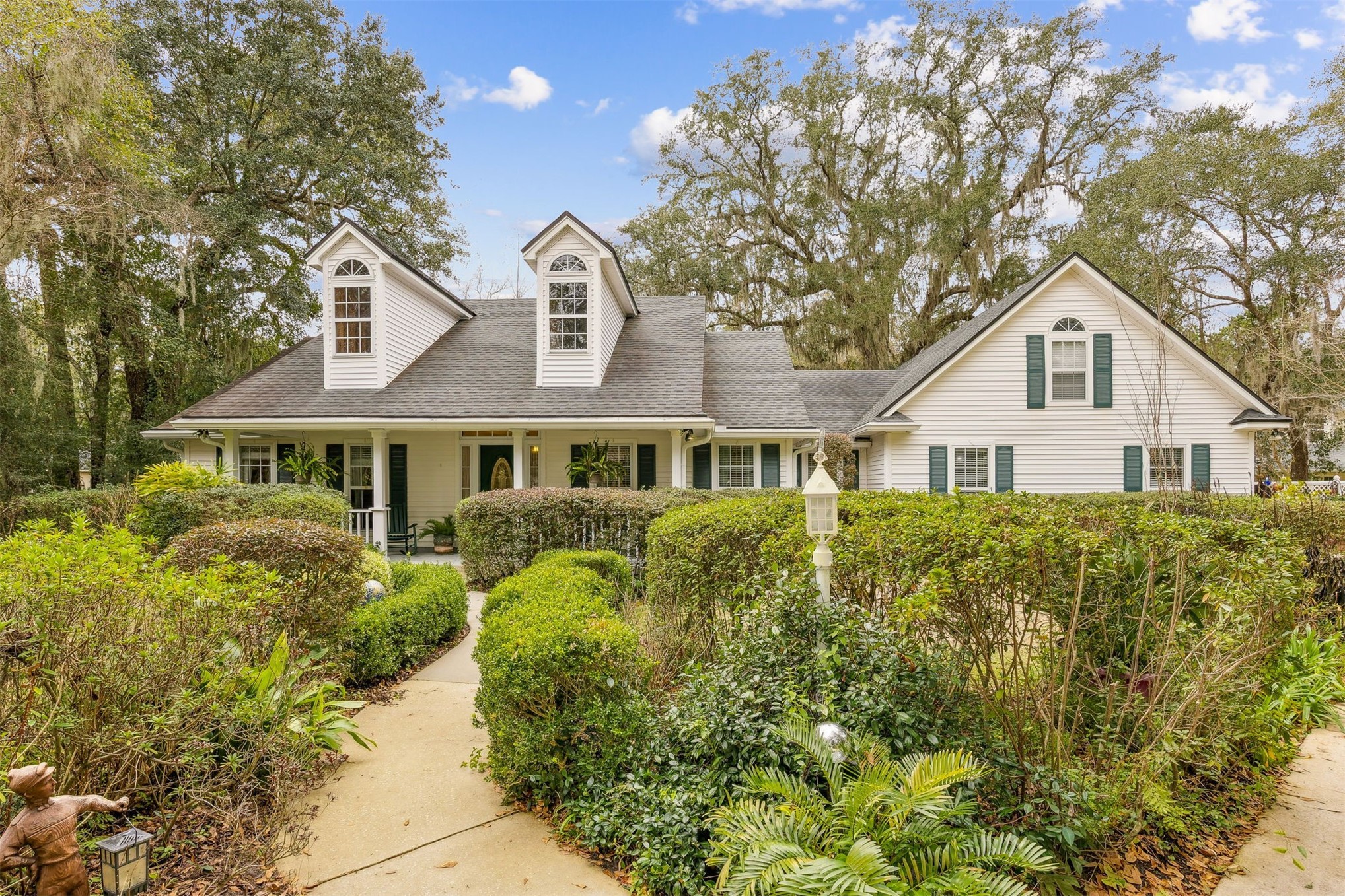 86341 Meadowfield Bluffs Road Yulee, FL 32097 - Photo 7 of 68 a front view of a house with a garden