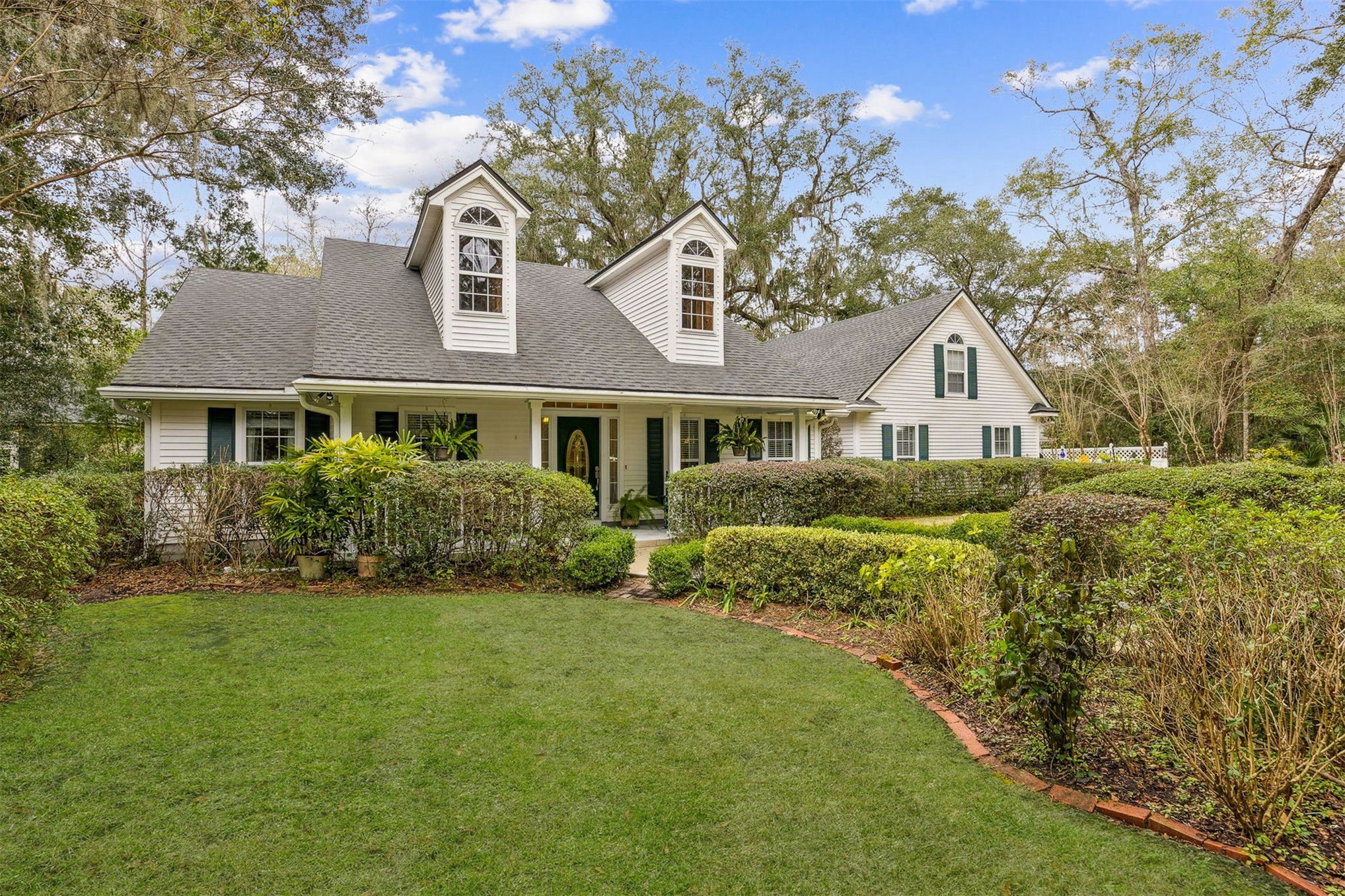 86341 Meadowfield Bluffs Road Yulee, FL 32097 - Photo 8 of 68 a front view of a house with a yard