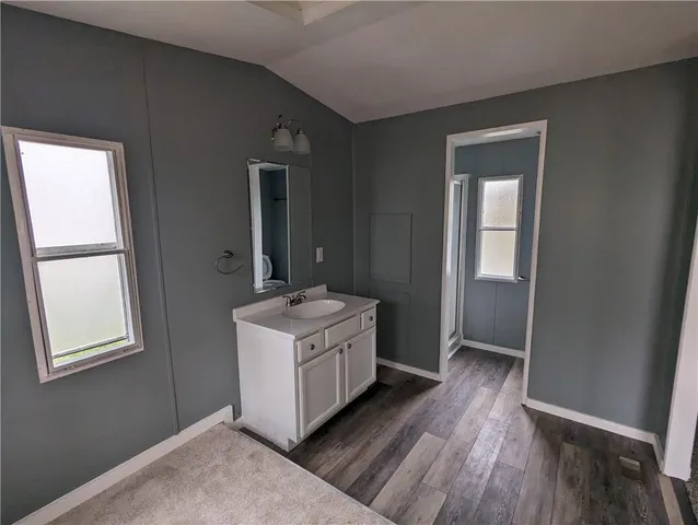 a room with a bed and a window