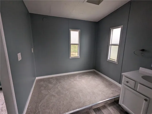 a view of an empty room and window