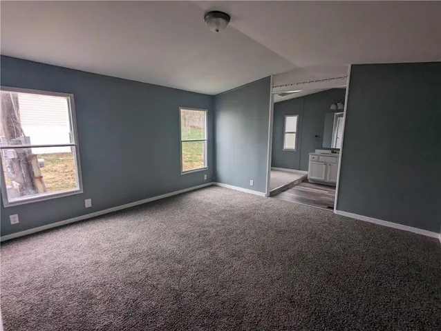 a view of deck with furniture and front door