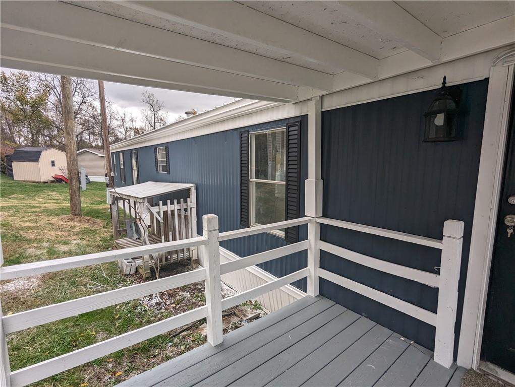514 Reed Circle Ruffs Dale, PA 15679 - Photo 19 of 19 a view of deck with furniture and front door