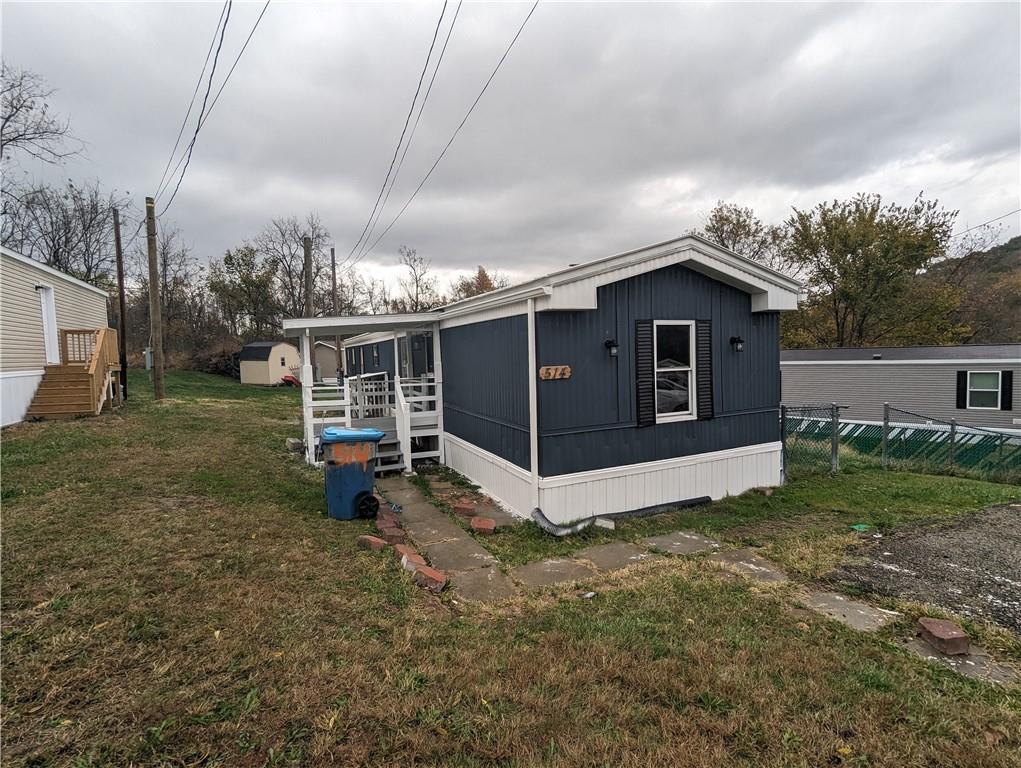 514 Reed Circle Ruffs Dale, PA 15679 - Photo 2 of 19 a view of a house with a yard