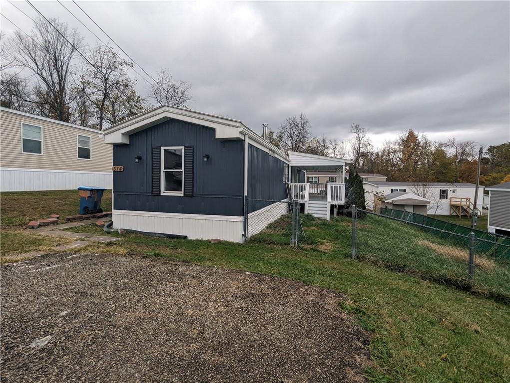 514 Reed Circle Ruffs Dale, PA 15679 - Photo 3 of 19 a view of a house with a yard