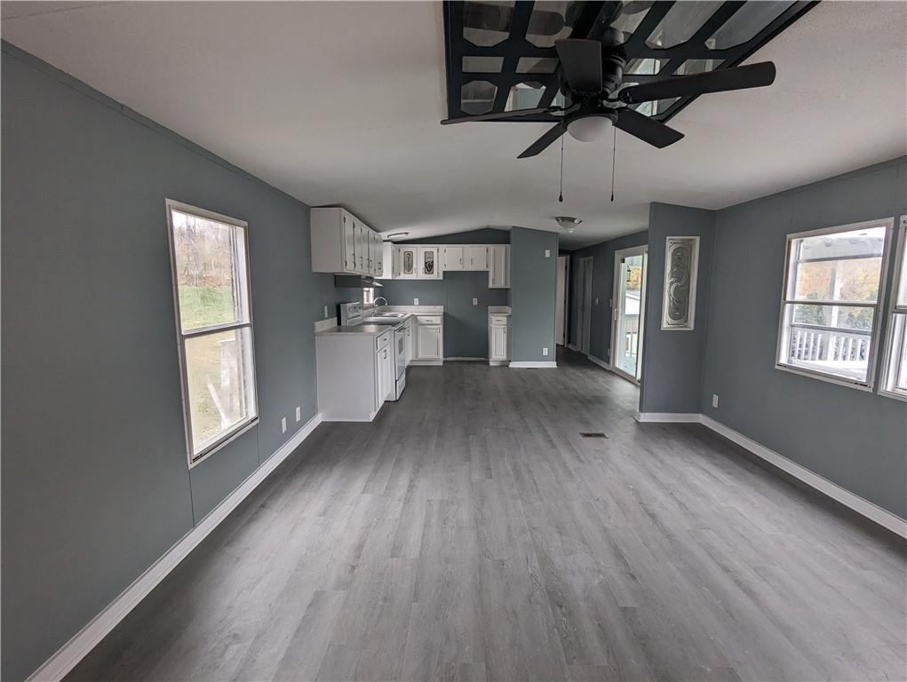 514 Reed Circle Ruffs Dale, PA 15679 - Photo 5 of 19 a view of an empty room with a window and wooden floor