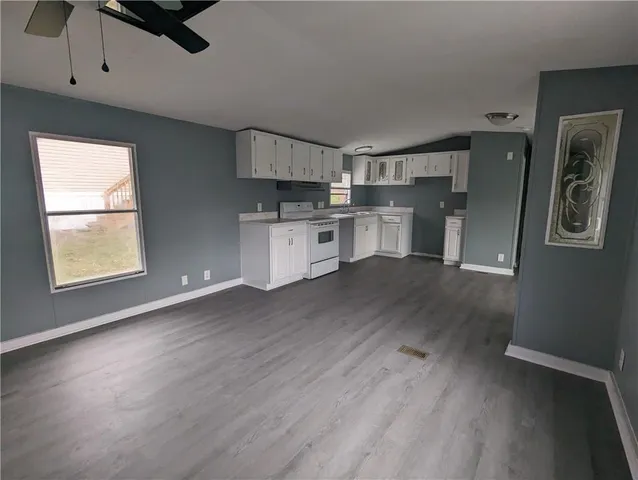 a view of a kitchen with electric appliances