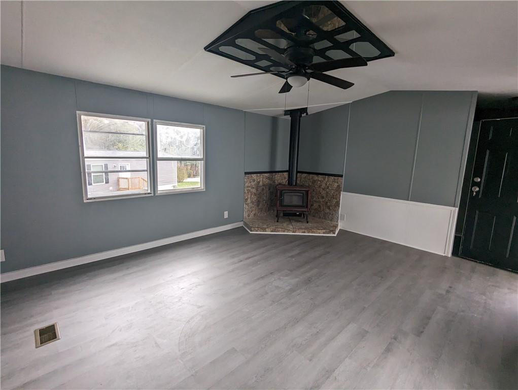 514 Reed Circle Ruffs Dale, PA 15679 - Photo 7 of 19 a view of empty room with a fireplace and wooden floor