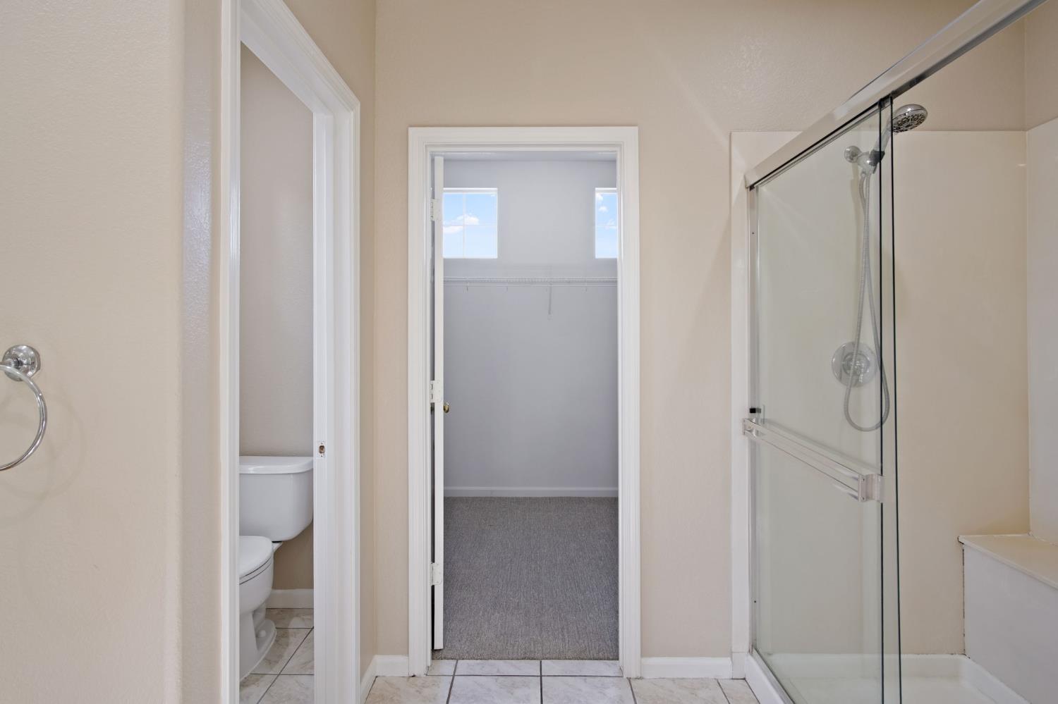 2921 Compton Place Tracy, CA 95377 - Photo 32 of 35 a bathroom with a glass shower door