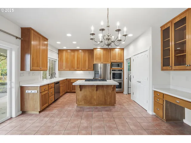 a large kitchen with a chandelier