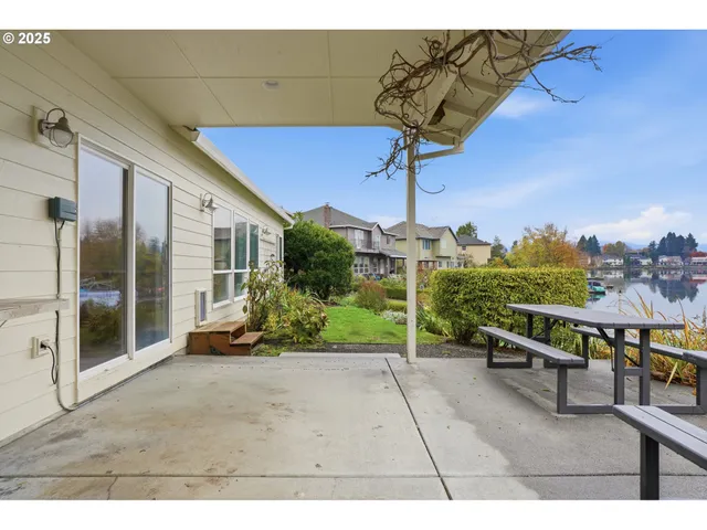 a view of a patio with a table and chairs