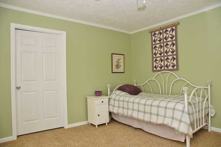 4825 Deer View Road Gretna, VA 24557 - Photo 16 of 23 a bedroom with a bed and dresser