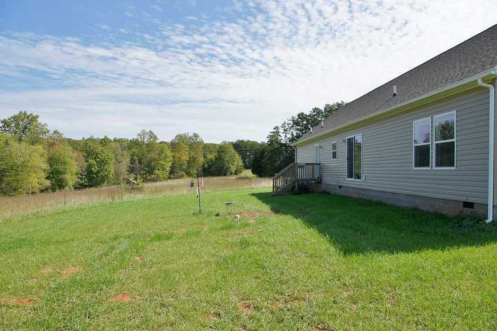 4825 Deer View Road Gretna, VA 24557 - Photo 20 of 23 a view of a backyard with plants and a garden