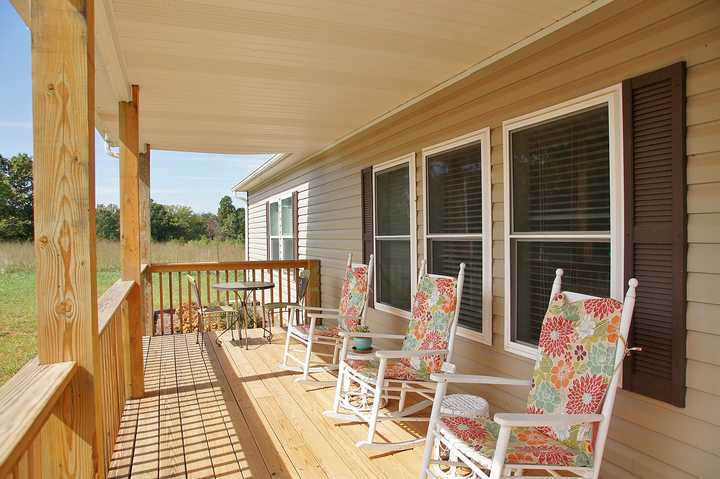4825 Deer View Road Gretna, VA 24557 - Photo 4 of 23 a view of a chairs on the roof deck