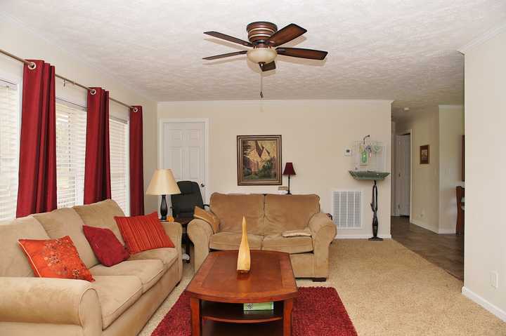 4825 Deer View Road Gretna, VA 24557 - Photo 7 of 23 a living room with furniture a large window and a chandelier