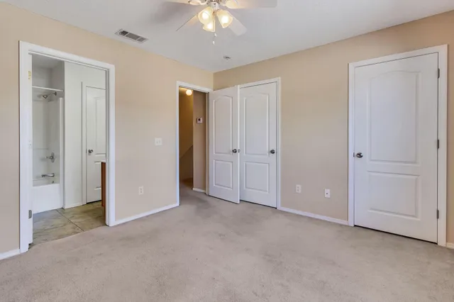 a view of an empty room and closet area