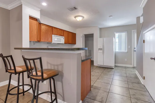 a view of a kitchen with furniture and a fireplace