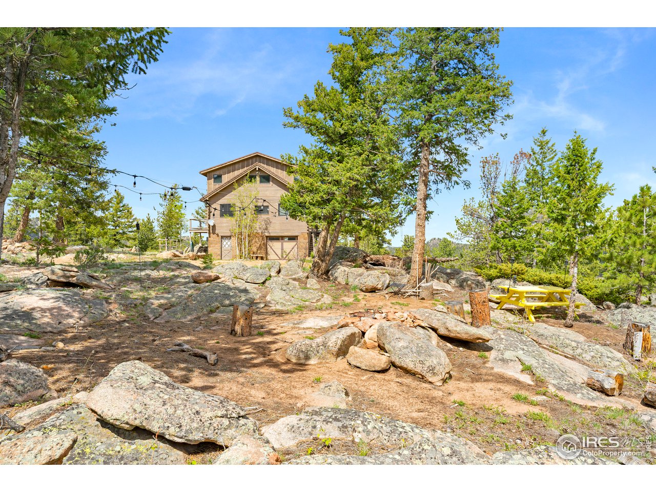 1359 Crow Road Red Feather Lakes, CO 80545 - Photo 20 of 23 Fire pit area hidden in natural rock formation.