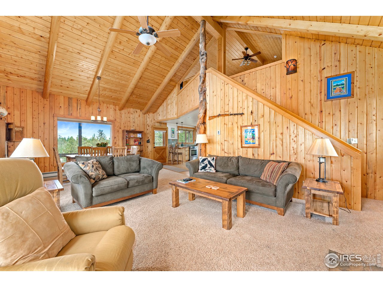 1359 Crow Road Red Feather Lakes, CO 80545 - Photo 4 of 23 The Great Room with warm knotty pine and wood ascents.