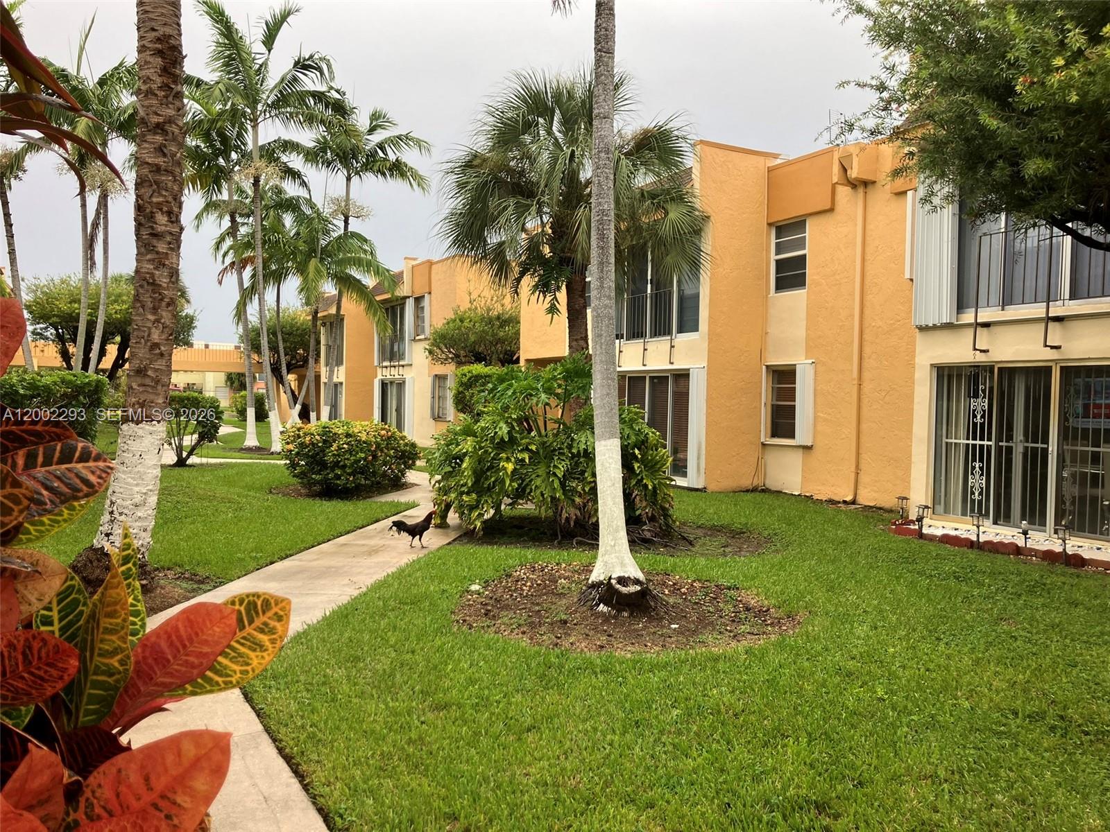 9311 Southwest 4th Street, Unit 104B Miami, FL 33174 - Photo 16 of 21 a view of a backyard with a garden