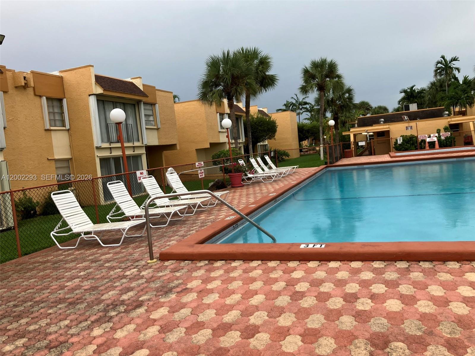 9311 Southwest 4th Street, Unit 104B Miami, FL 33174 - Photo 18 of 21 an outdoor space with lounge chair