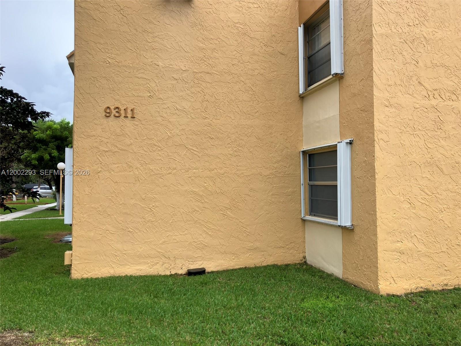9311 Southwest 4th Street, Unit 104B Miami, FL 33174 - Photo 21 of 21 a view of outdoor space and yard