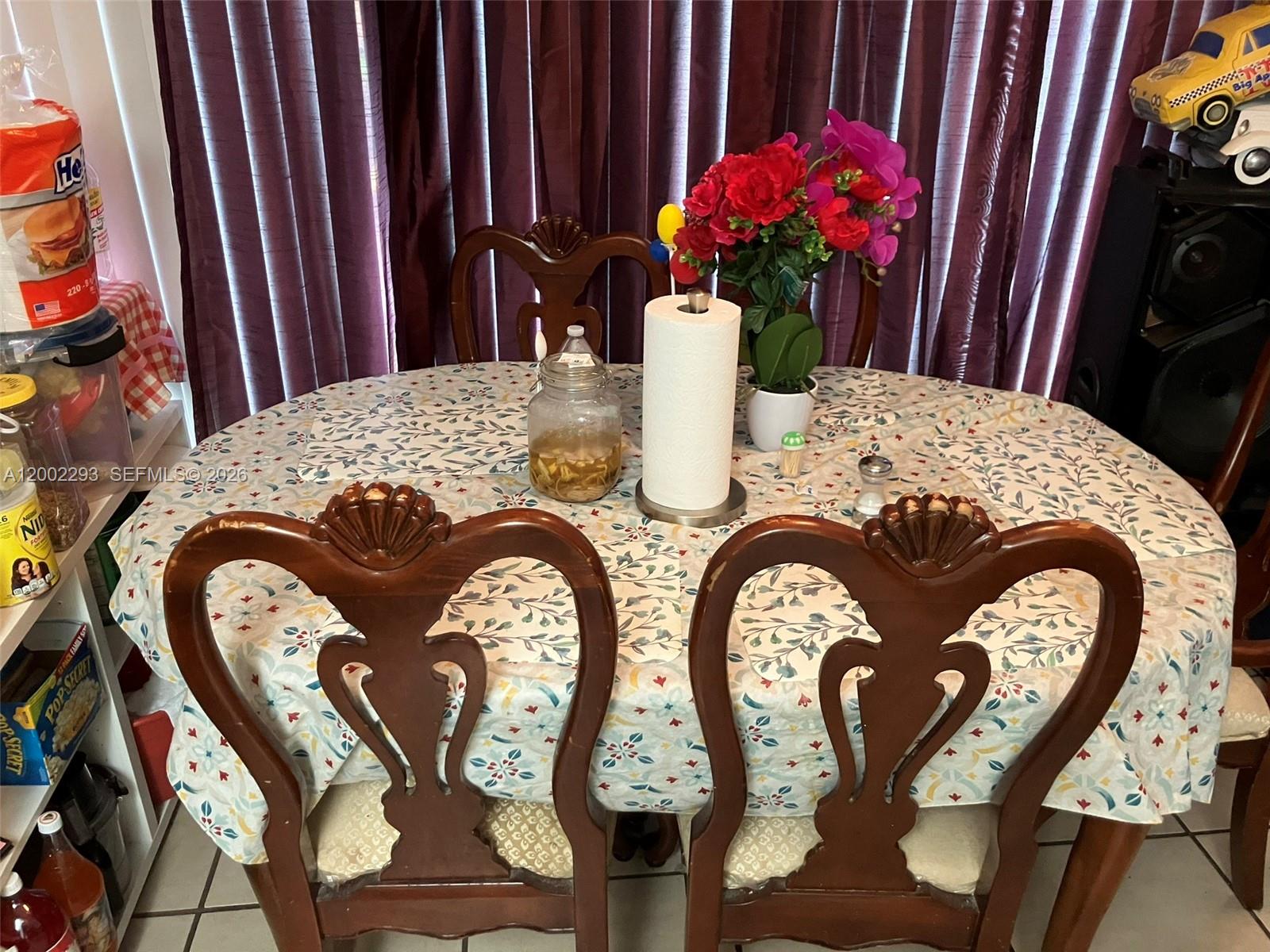 9311 Southwest 4th Street, Unit 104B Miami, FL 33174 - Photo 3 of 21 a view of a dining room with furniture and wooden floor