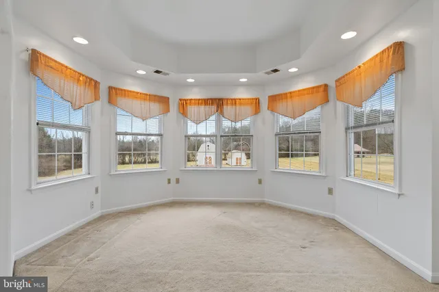 a bathroom with a sink a toilet a mirror and shower