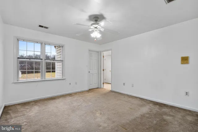 a view of a house with a yard porch and sitting area