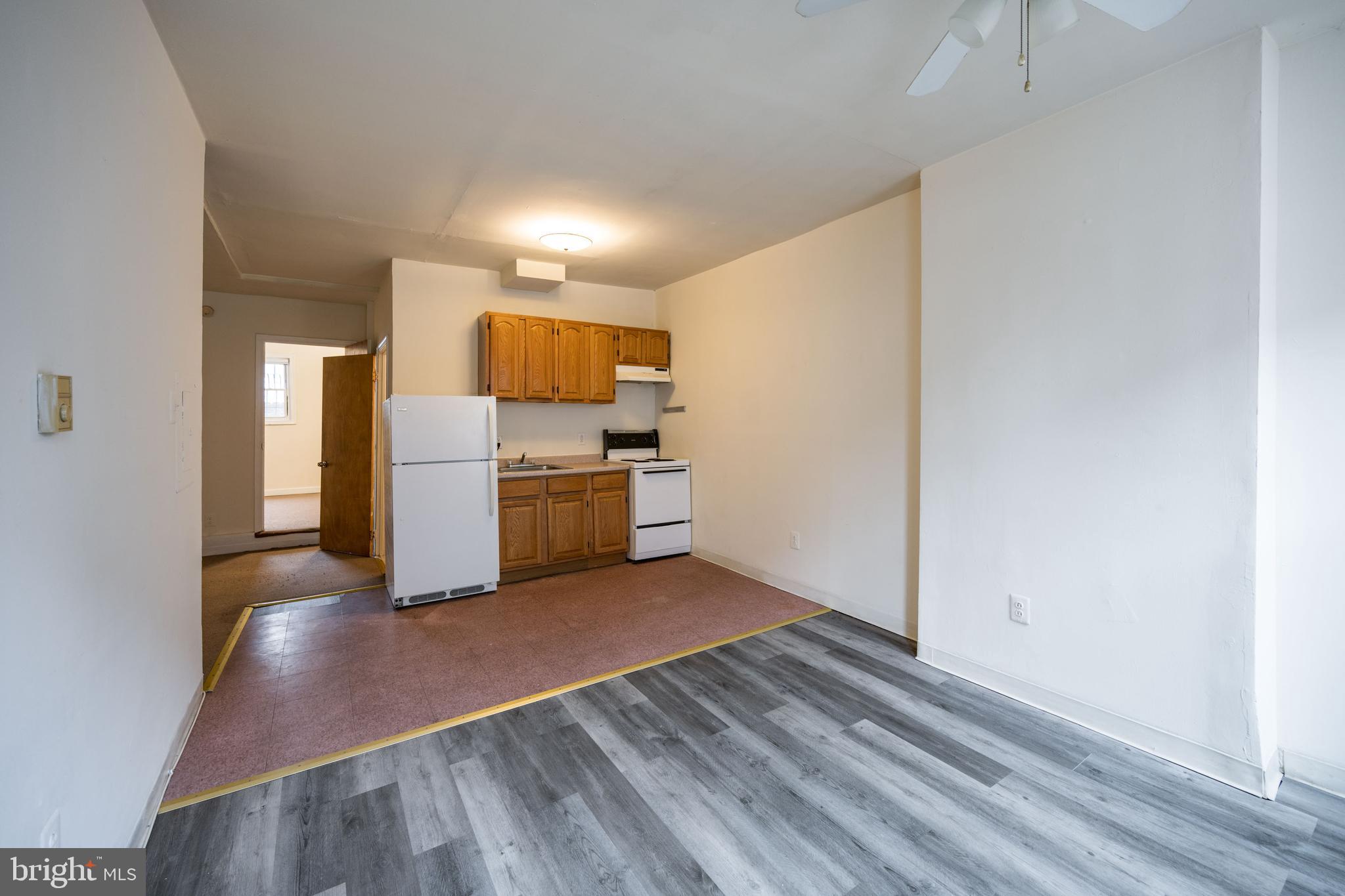 a view of kitchen with wooden floor