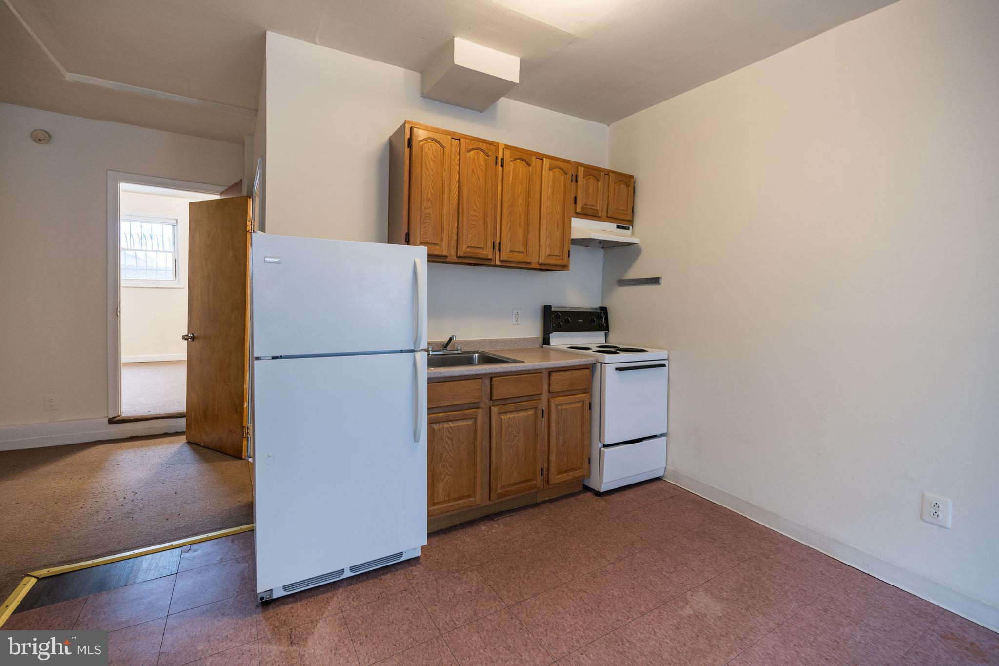 1534 South 4th Street Philadelphia, PA 19147 - Photo 3 of 11 a kitchen with a refrigerator and a sink