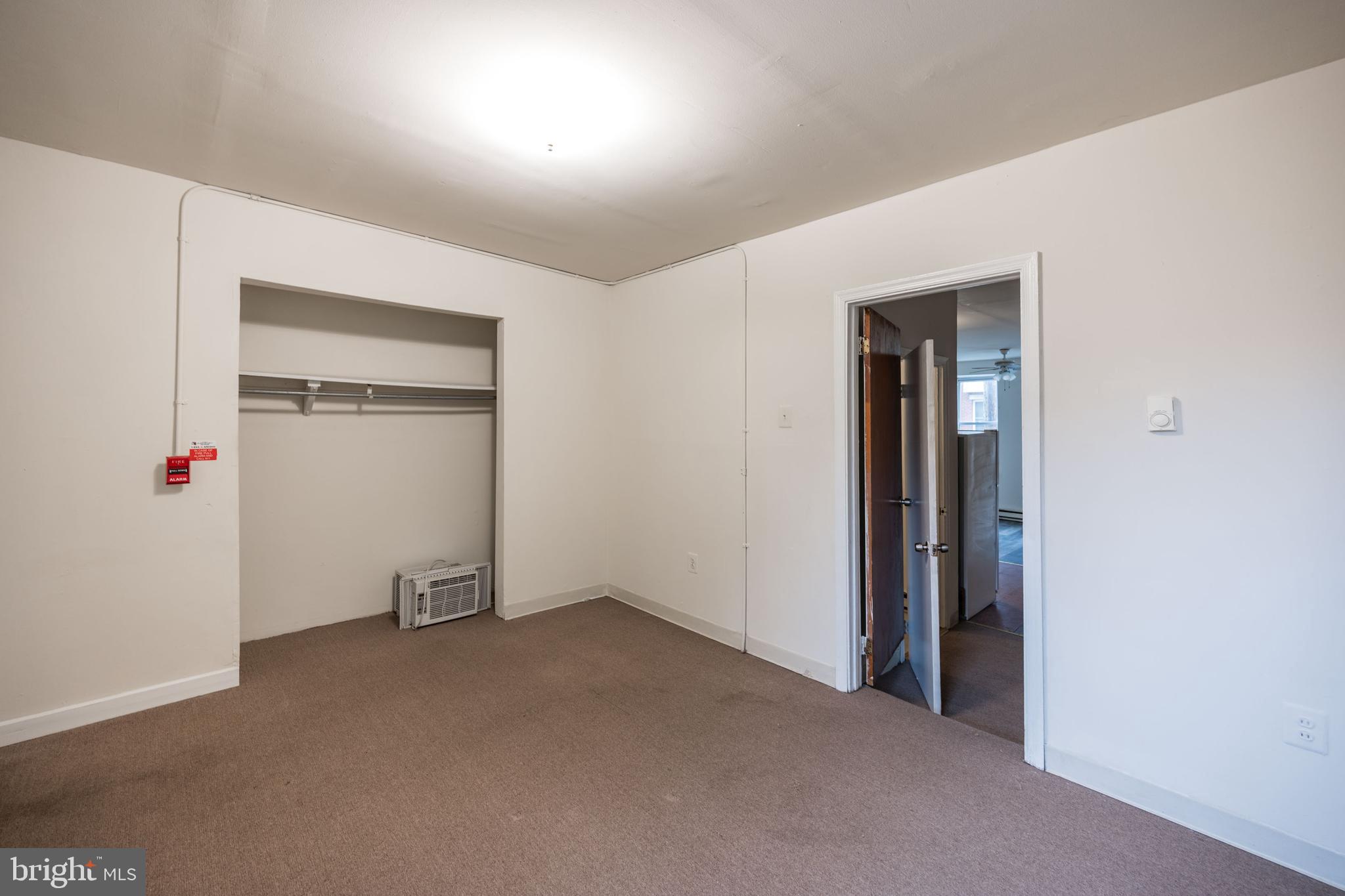 1534 South 4th Street Philadelphia, PA 19147 - Photo 6 of 11 an empty room with white cabinet and a white door
