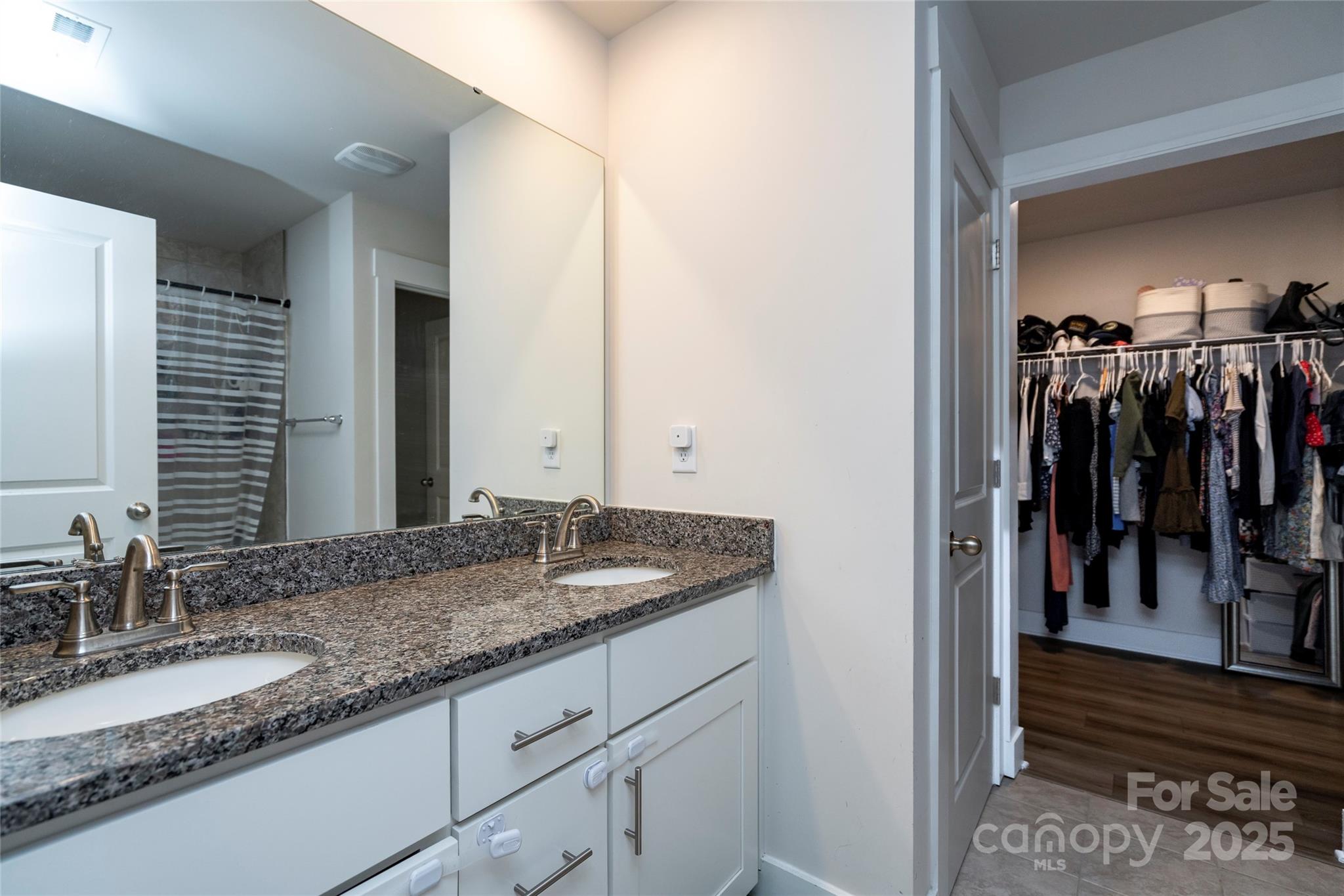 17359 Huntersville-Concord Road Huntersville, NC 28078 - Photo 24 of 41 a bathroom with a granite countertop sink and a mirror