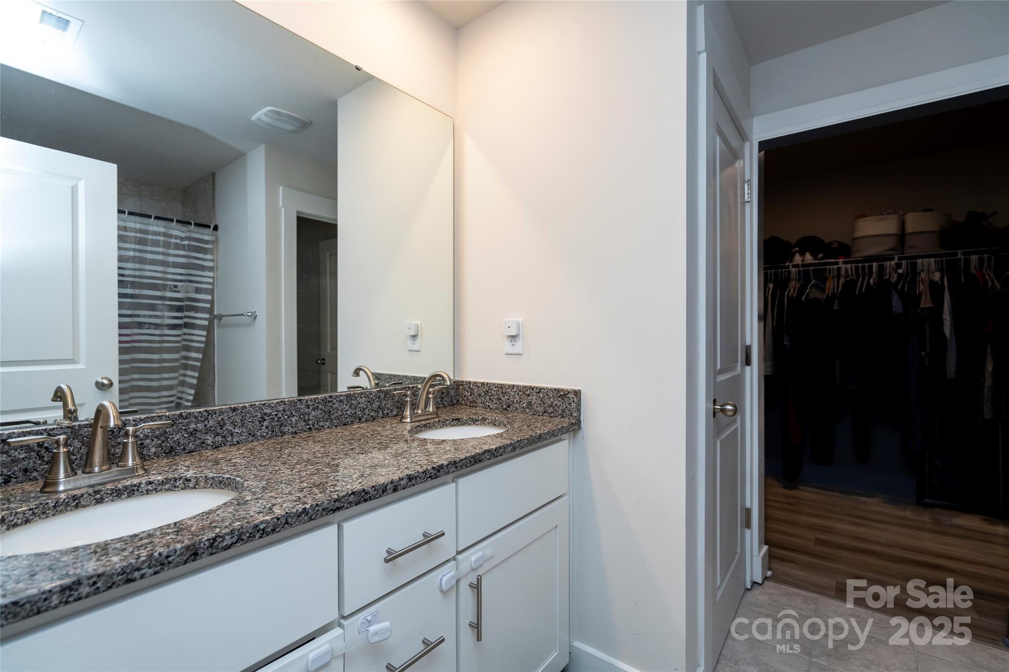 17359 Huntersville-Concord Road Huntersville, NC 28078 - Photo 25 of 41 a bathroom with a granite countertop sink and a mirror