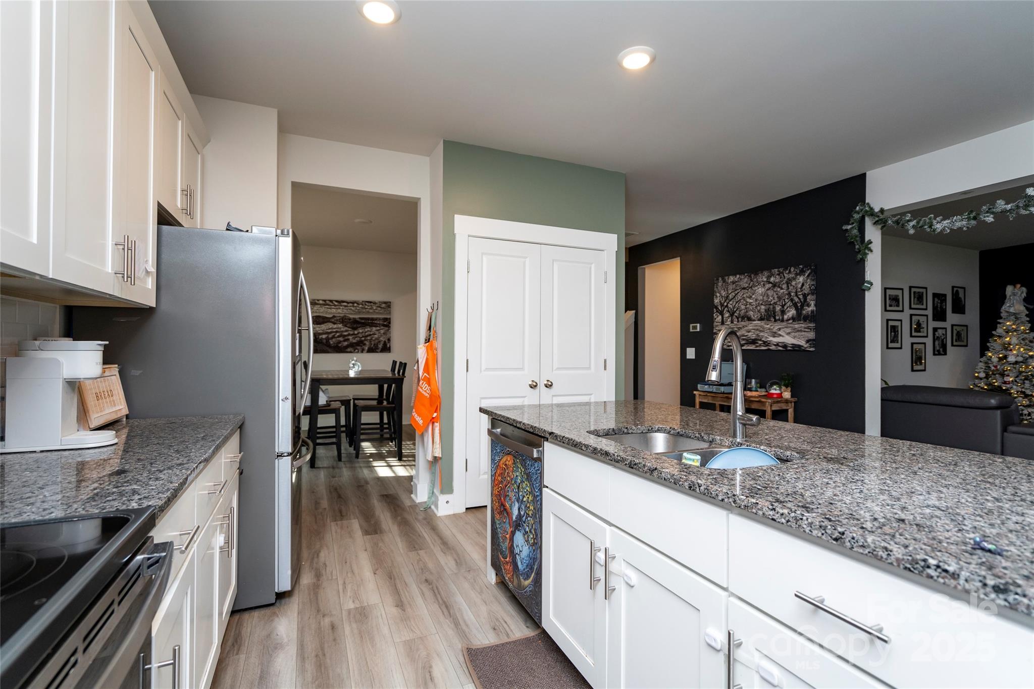 17359 Huntersville-Concord Road Huntersville, NC 28078 - Photo 9 of 41 a kitchen with stainless steel appliances granite countertop a stove and a sink