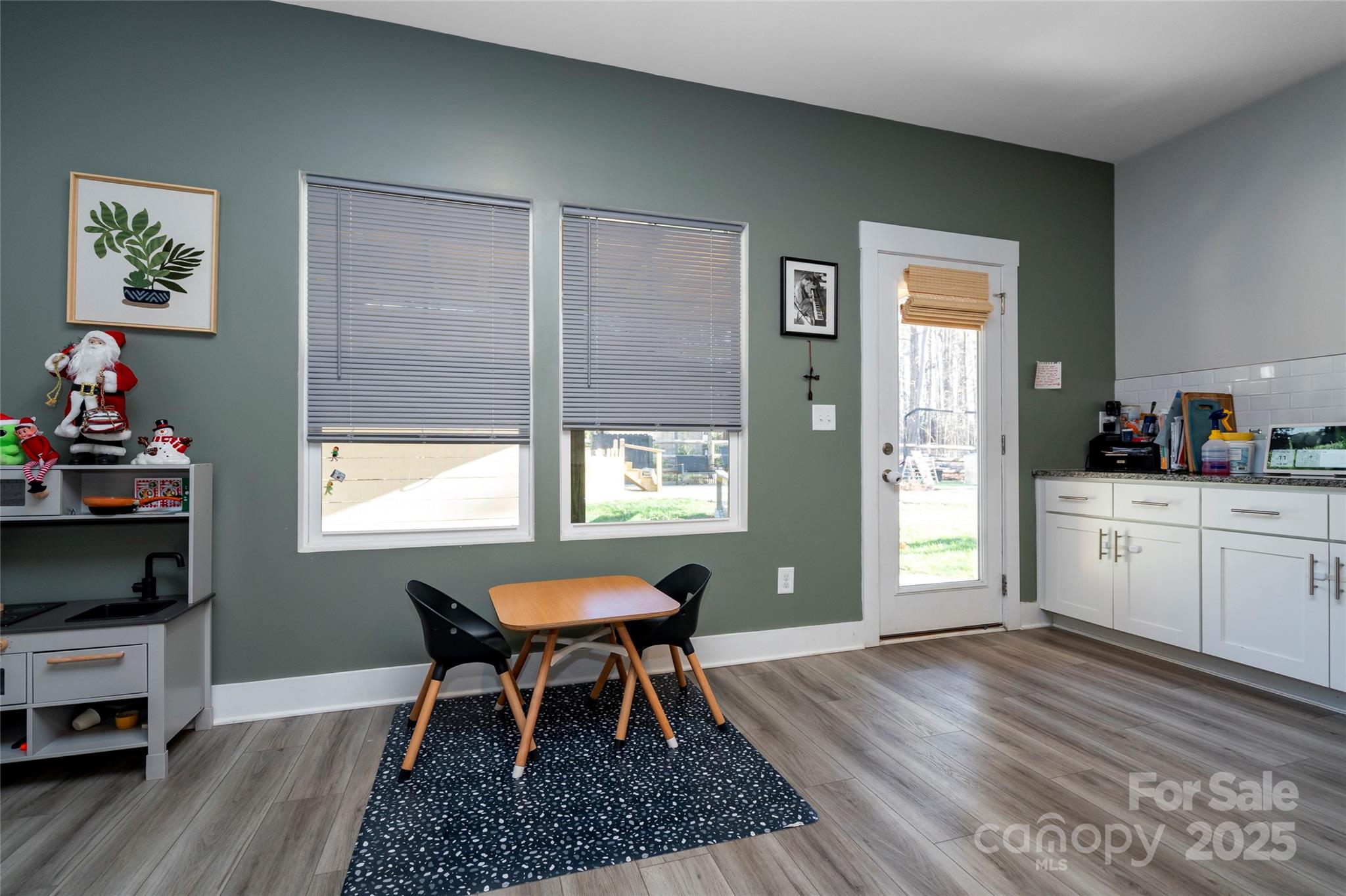 17359 Huntersville-Concord Road Huntersville, NC 28078 - Photo 10 of 41 a view of a dining room with furniture and wooden floor