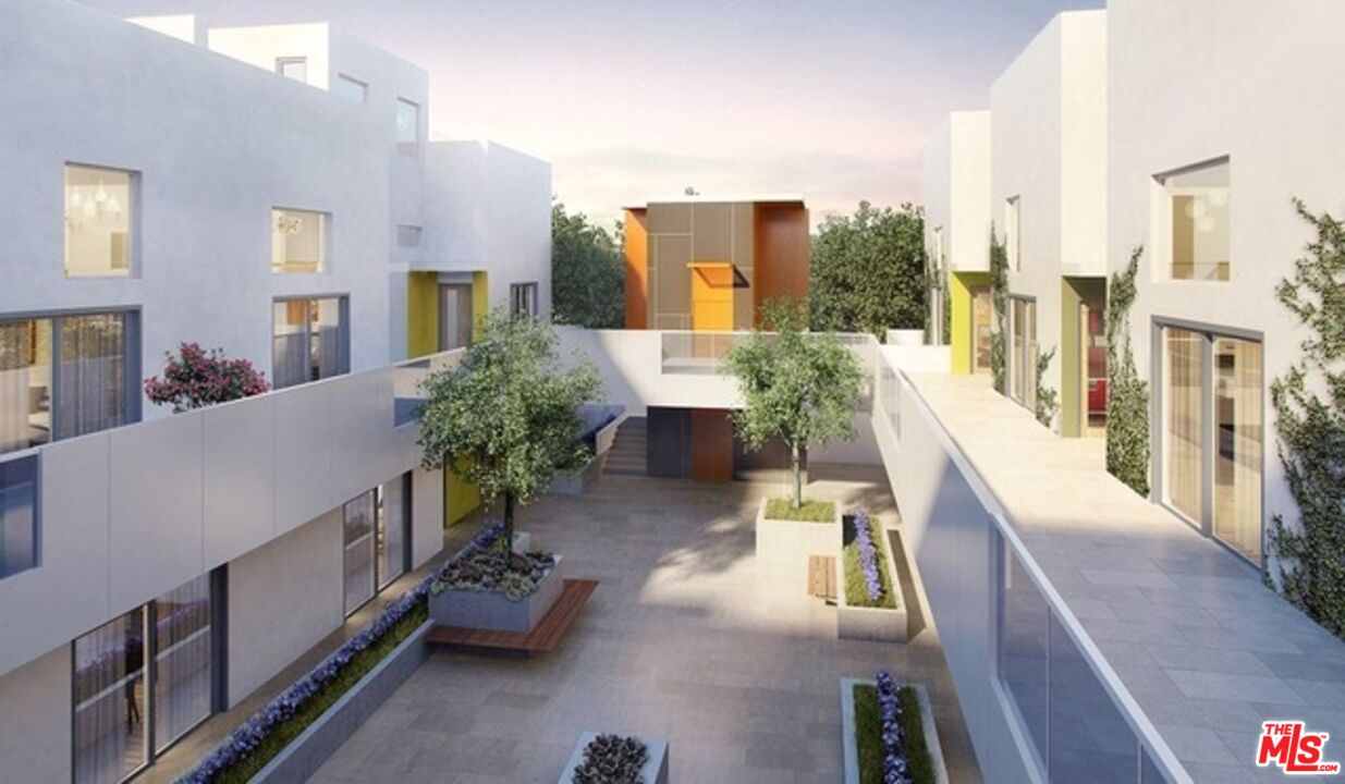 1433 14th Street, Unit 16 Santa Monica, CA 90404 - Photo 4 of 5 a lobby with furniture and potted plants