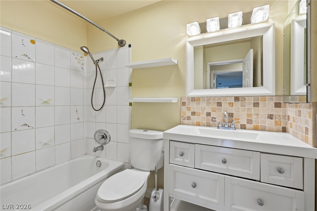 3971 Spring Leaf Drive Las Vegas, NV 89147 - Photo 33 of 48 A well-maintained bathroom provides a classic vanity and a clean bathtub/shower combination.