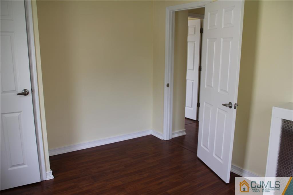 522 Front Street Dunellen, NJ 08812 - Photo 15 of 24 a view of a hallway with wooden floor