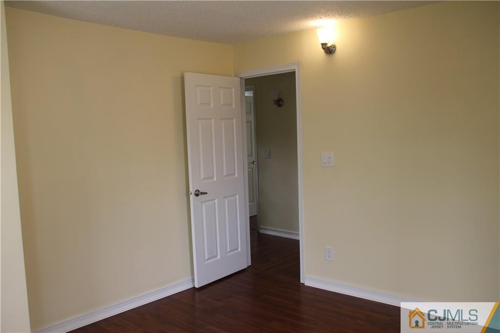 522 Front Street Dunellen, NJ 08812 - Photo 16 of 24 a view of a hallway with wooden floor