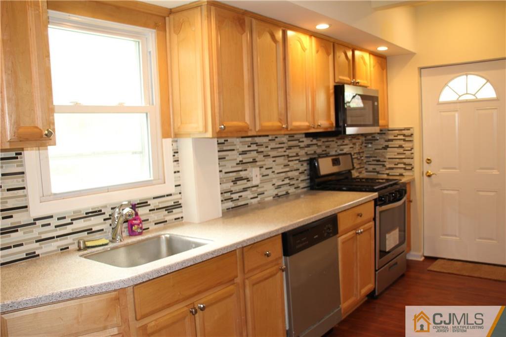 522 Front Street Dunellen, NJ 08812 - Photo 3 of 24 a bathroom with a sink and a mirror