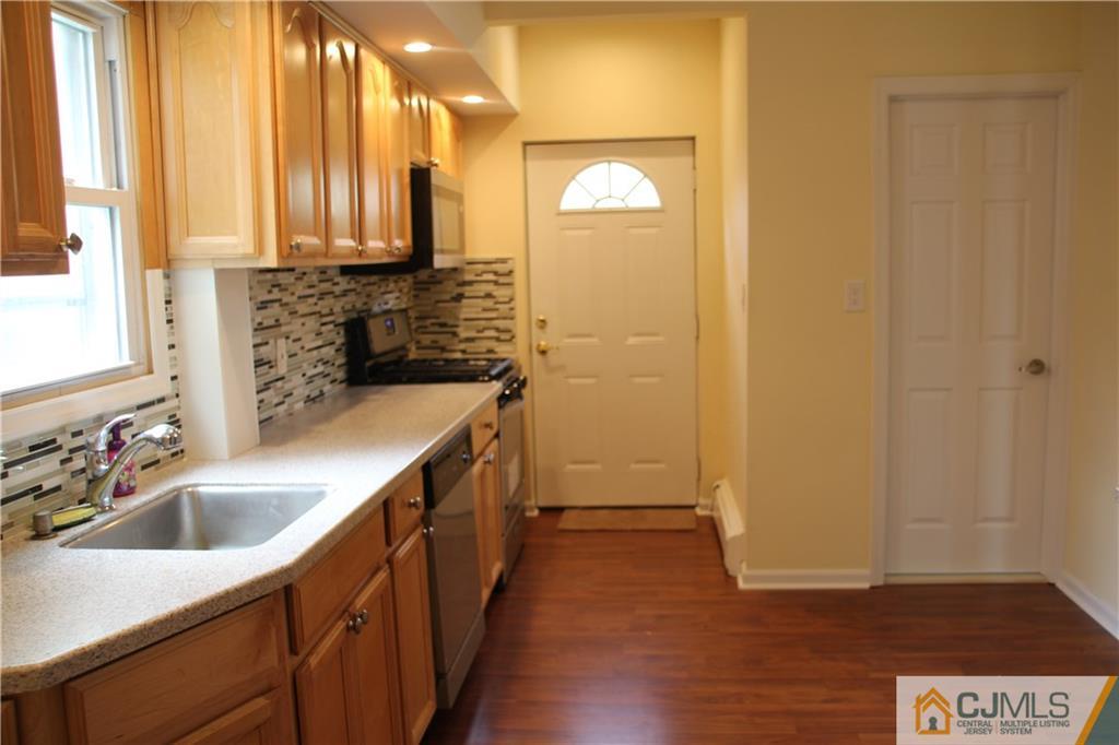 522 Front Street Dunellen, NJ 08812 - Photo 4 of 24 a kitchen with a sink and a window