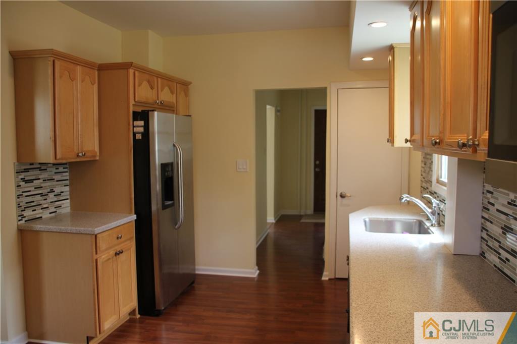 522 Front Street Dunellen, NJ 08812 - Photo 5 of 24 a kitchen with a refrigerator and a sink