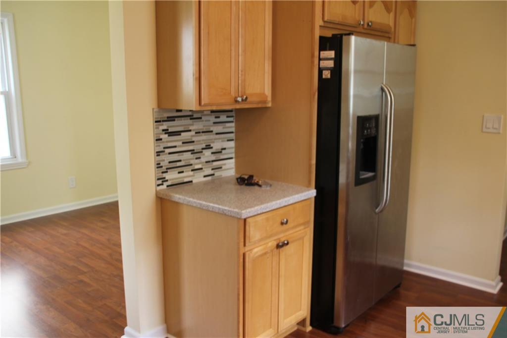 522 Front Street Dunellen, NJ 08812 - Photo 6 of 24 a kitchen with a refrigerator and a stove