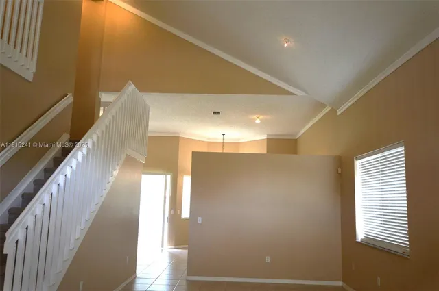 a view of a hallway with windows